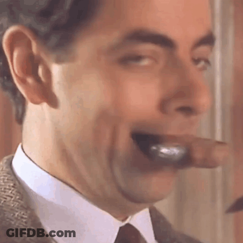 A Close Up Of A Man Smoking A Cigar With His Mouth Open . GIF