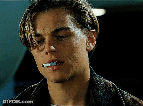 A Close Up Of A Man Smoking A Cigarette In His Mouth GIF