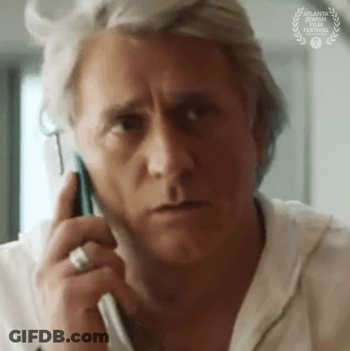 Close Up Of Man Talking On Cell Phone GIF