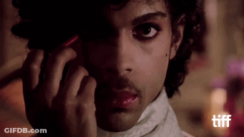 A Close Up Of A Man Talking On A Cell Phone GIF