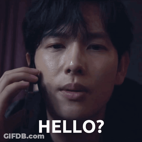 A Close Up Of A Man Talking On A Cell Phone With The Words Hello Written On The Bottom GIF