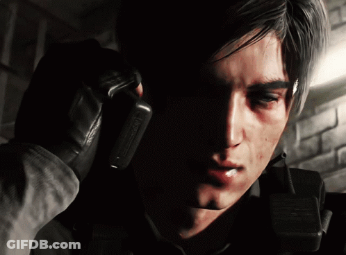 A Close Up Of A Man Talking On A Walkie Talkie With The Word Warning On It GIF