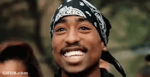 A Close Up Of A Man Wearing A Bandana Smiling . GIF