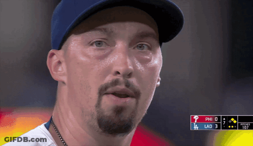 A Close Up Of A Man Wearing A Baseball Cap With The Letters Phi And Lad Visible GIF