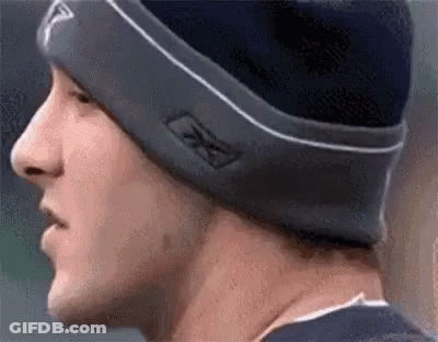 A Close Up Of A Man Wearing A Beanie And A Hat . GIF