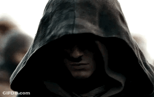 A Close Up Of A Man Wearing A Black Hood GIF