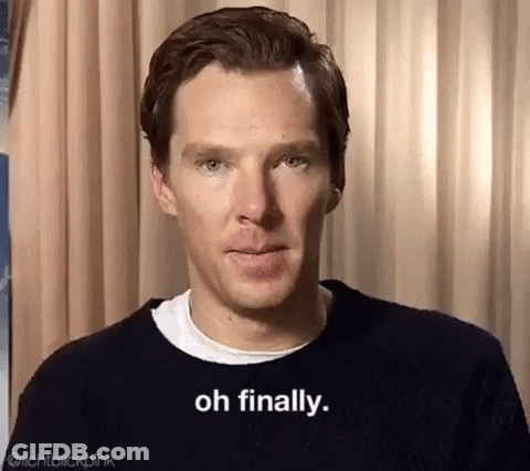 A Close Up Of A Man Wearing A Black Sweater And A White Shirt . GIF