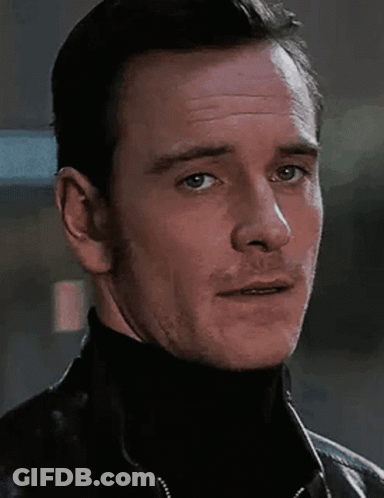 A Close Up Of A Man Wearing A Black Turtleneck And A Black Jacket GIF