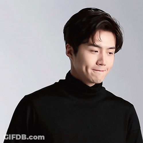 A Close Up Of A Man Wearing A Black Turtleneck GIF