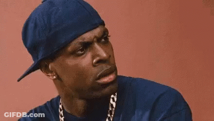A Close Up Of A Man Wearing A Blue Hat And A Chain . GIF