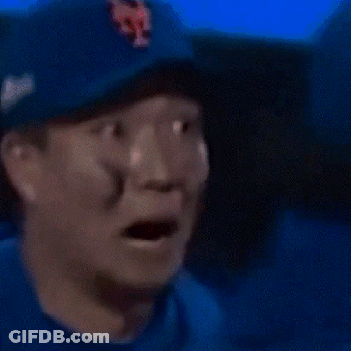 A Close Up Of A Man Wearing A Blue Hat With A Ny On It GIF