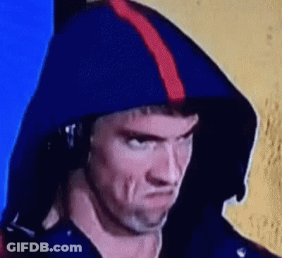 A Close Up Of A Man Wearing A Blue Hoodie And Headphones . GIF