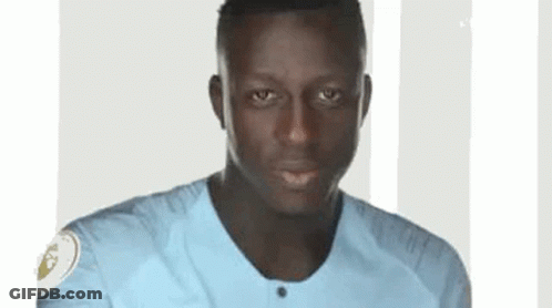 A Close Up Of A Man Wearing A Blue Shirt . GIF