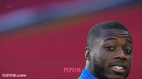 A Close Up Of A Man Wearing A Blue Shirt That Says Pepsi GIF