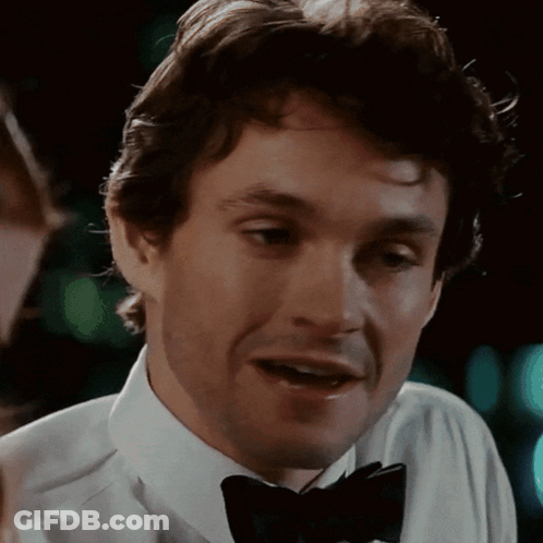 A Close Up Of A Man Wearing A Bow Tie And A White Shirt GIF