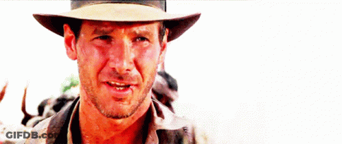 A Close Up Of A Man Wearing A Cowboy Hat And Smiling GIF