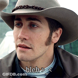 A Close Up Of A Man Wearing A Cowboy Hat With Bleh Written Below Him GIF