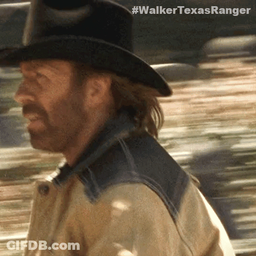 A Close Up Of A Man Wearing A Cowboy Hat With The Hashtag #Walkertexasranger On The Bottom Right GIF