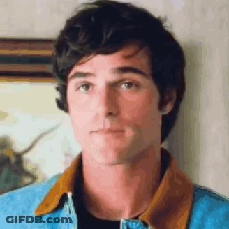 A Close Up Of A Man Wearing A Denim Jacket GIF