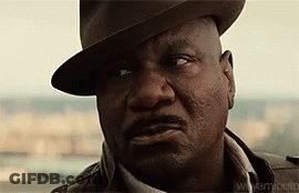 A Close Up Of A Man Wearing A Hat And A Jacket . GIF