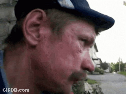 A Close Up Of A Man Wearing A Hat And A Mustache GIF