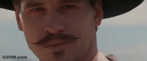 A Close Up Of A Man Wearing A Hat And A Mustache . GIF