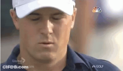 A Close Up Of A Man Wearing A Hat And A Shirt . GIF