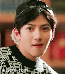 A Close Up Of A Man Wearing A Hat And A Sweater . GIF