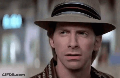 A Close Up Of A Man Wearing A Hat Making A Funny Face . GIF