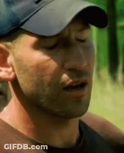 A Close Up Of A Man Wearing A Hat GIF