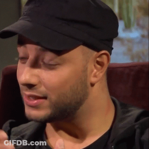 A Close Up Of A Man Wearing A Hat GIF