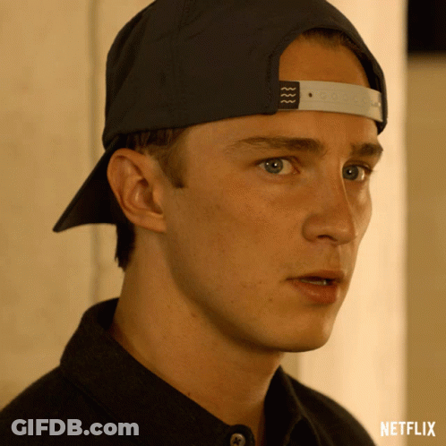 A Close Up Of A Man Wearing A Hat With The Word Netflix On The Bottom Right GIF
