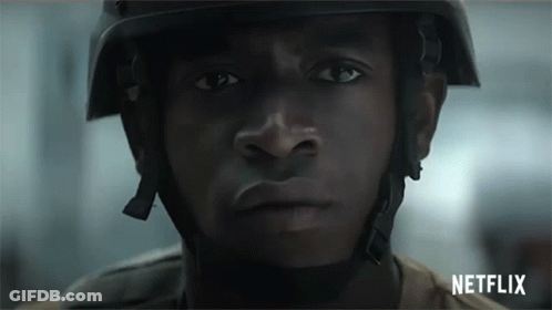 A Close Up Of A Man Wearing A Helmet And A Netflix Logo GIF