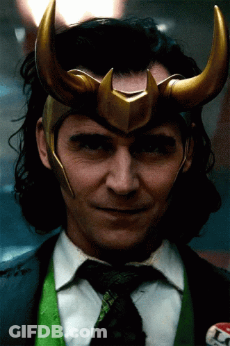 A Close Up Of A Man Wearing A Helmet And A Tie GIF