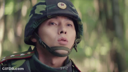 A Close Up Of A Man Wearing A Helmet With A Star On It GIF