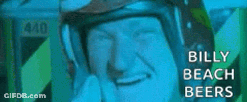 A Close Up Of A Man Wearing A Helmet With The Words `` Billy Beach Beers '' On It . GIF