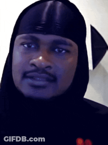 A Close Up Of A Man Wearing A Hood GIF