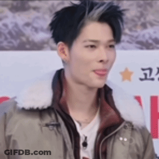 A Close Up Of A Man Wearing A Jacket And A White Collar . GIF