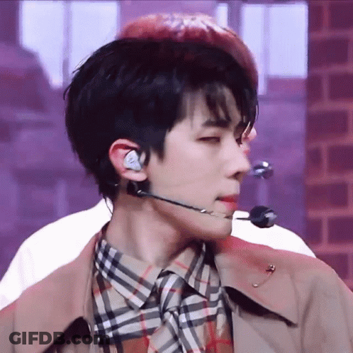A Close Up Of A Man Wearing A Microphone And Earphones GIF