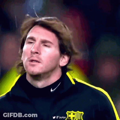 A Close Up Of A Man Wearing A Nike Jacket With A Fc Barcelona Logo On It GIF