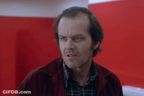 A Close Up Of A Man Wearing A Plaid Shirt And A Red Jacket . GIF