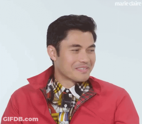 A Close Up Of A Man Wearing A Red Jacket And A Plaid Shirt . GIF