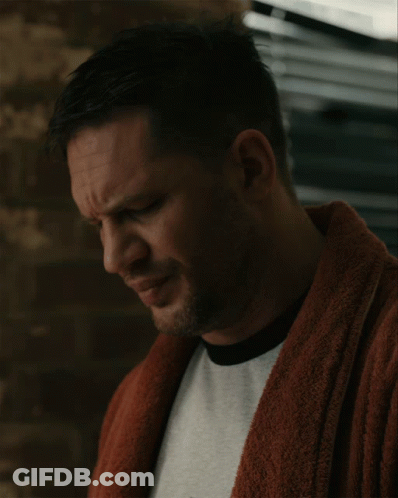 A Close Up Of A Man Wearing A Robe And A White Shirt GIF