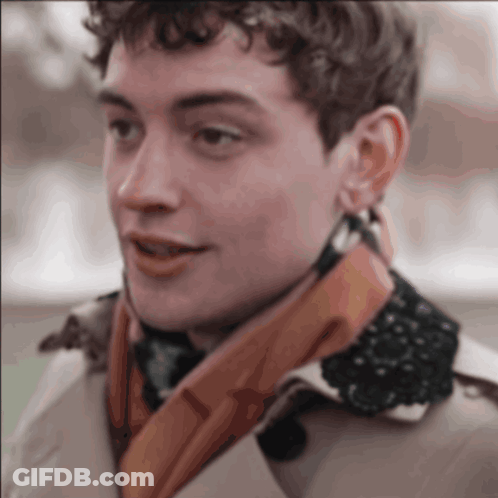 A Close Up Of A Man Wearing A Scarf GIF