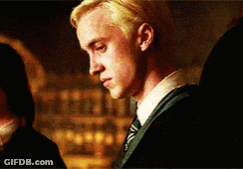 A Close Up Of A Man Wearing A Suit And Tie . GIF