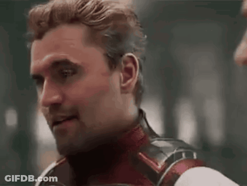 A Close Up Of A Man Wearing A Superhero Costume Making A Funny Face . GIF