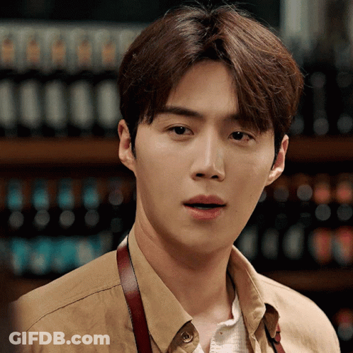 A Close Up Of A Man Wearing A Tan Shirt GIF
