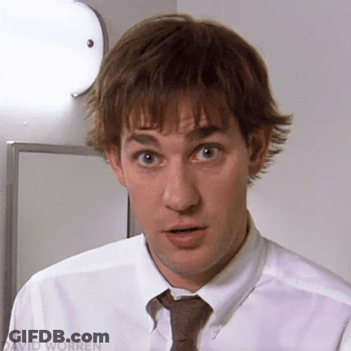 A Close Up Of A Man Wearing A White Shirt And Tie Making A Surprised Face GIF