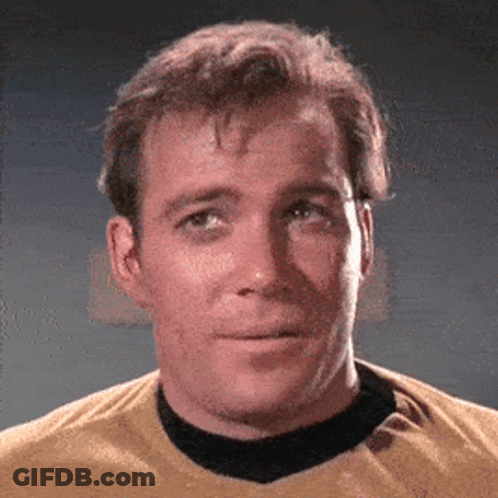 A Close Up Of A Man Wearing A Yellow Shirt And Black Collar GIF