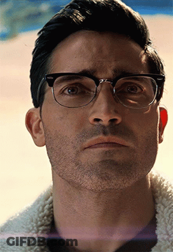 A Close Up Of A Man Wearing Glasses And A Beard GIF